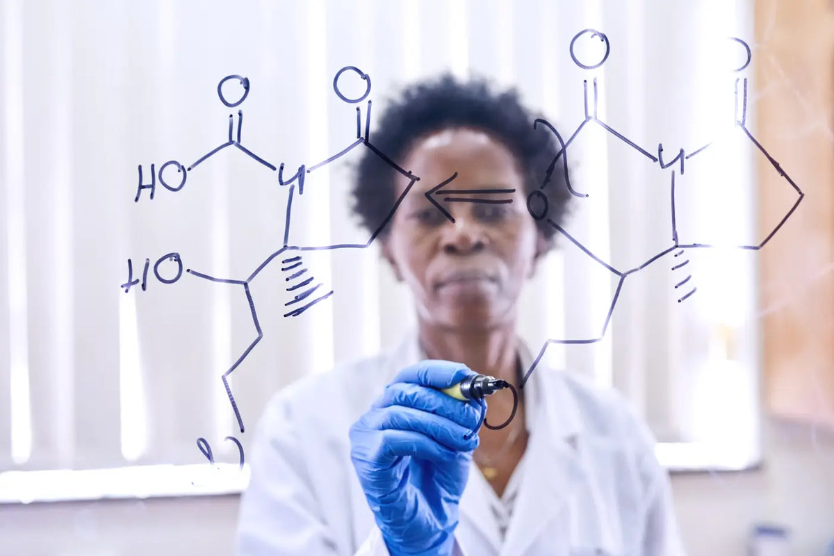 CBD Chemical Structure drawn by a women with pen